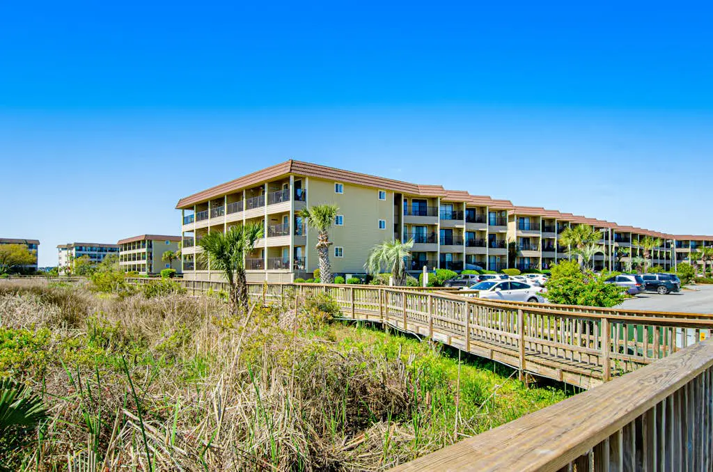 1st floor condo with  balcony, pools, tennis & close to beach