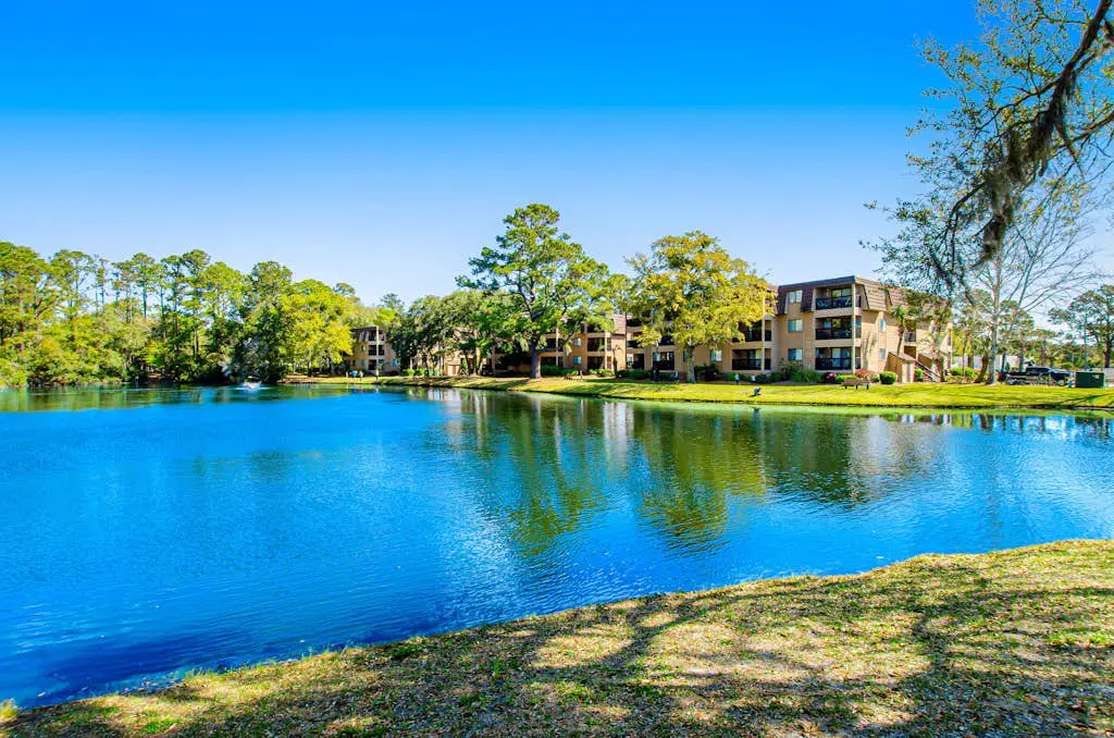 1st floor condo with  balcony, pools, tennis & close to beach