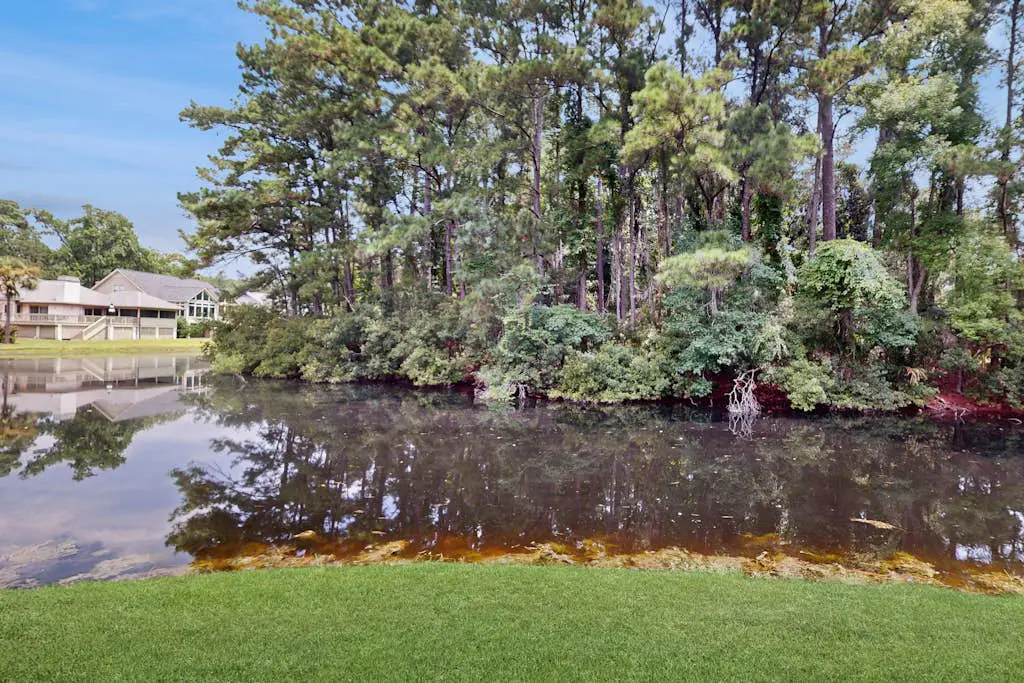 Charming condo with lagoons views, shared pool, golf nearby, and deck