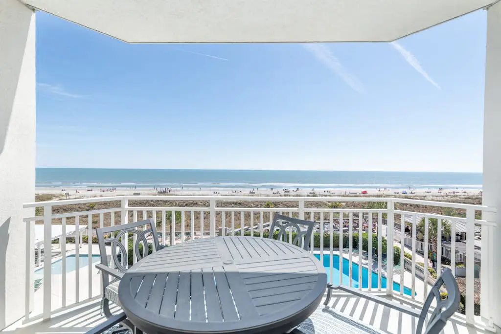 Panoramic direct oceanfront view condo w/ pool, hot tub, gym & steps to beach