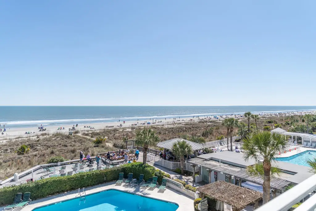 Panoramic direct oceanfront view condo w/ pool, hot tub, gym & steps to beach