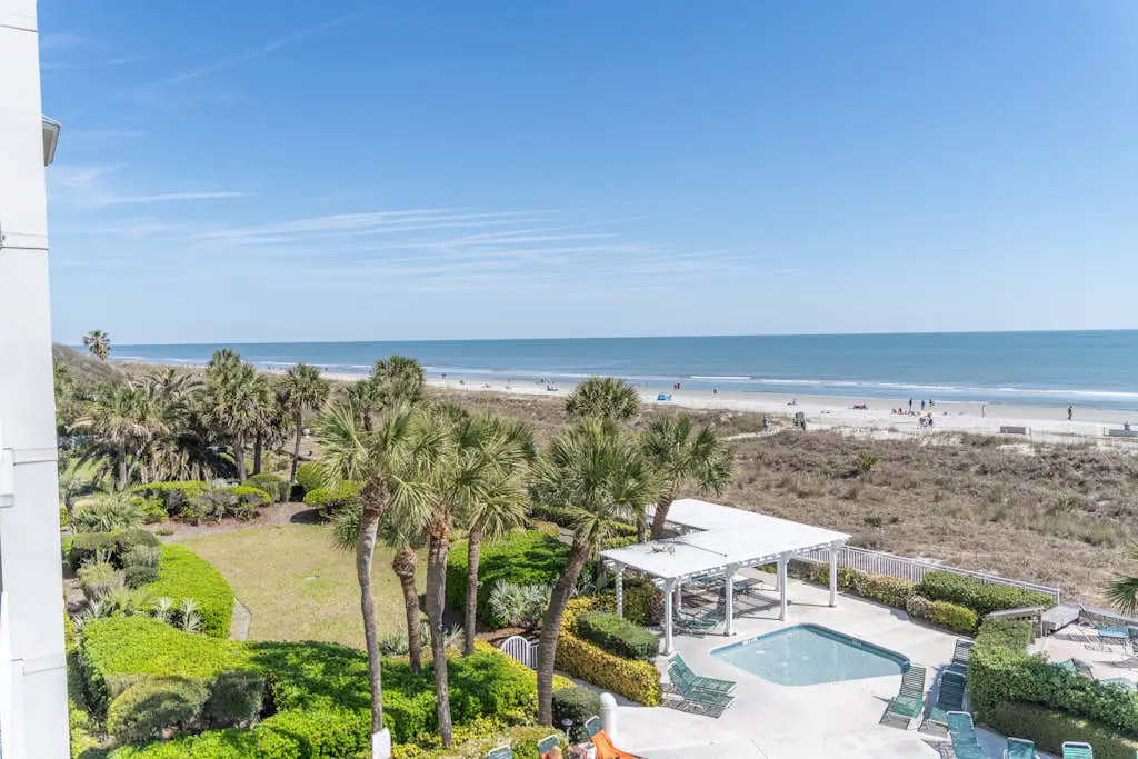 Panoramic direct oceanfront view condo w/ pool, hot tub, gym & steps to beach