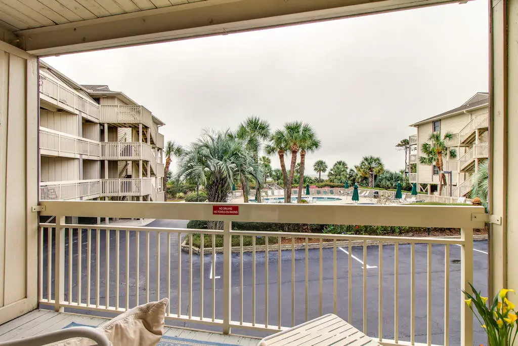 Beachside Condo with Shared Pool & Private Balcony Retreat