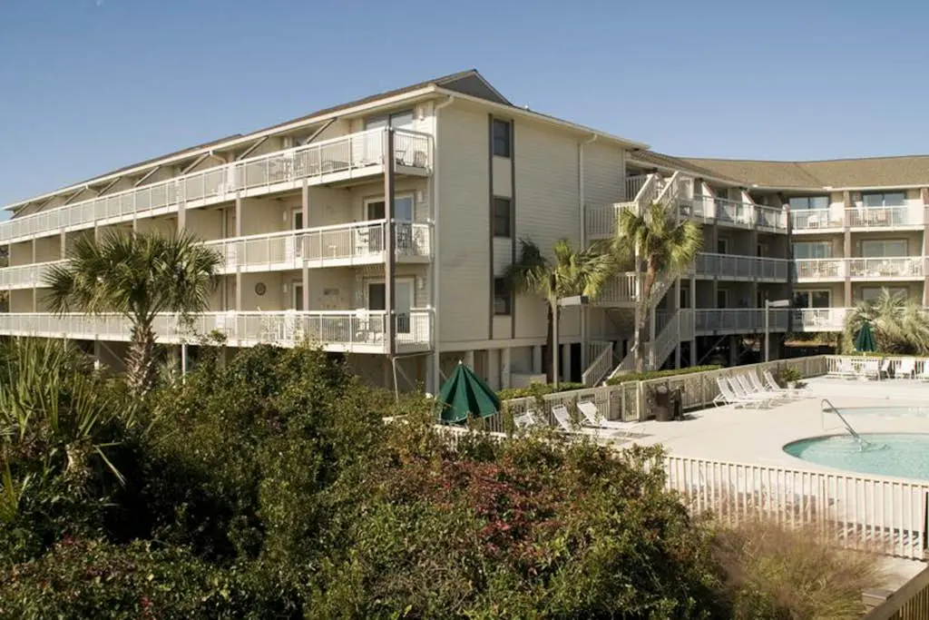 Beachside Condo with Shared Pool & Private Balcony Retreat