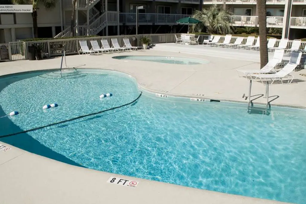 Beachside Condo with Shared Pool & Private Balcony Retreat