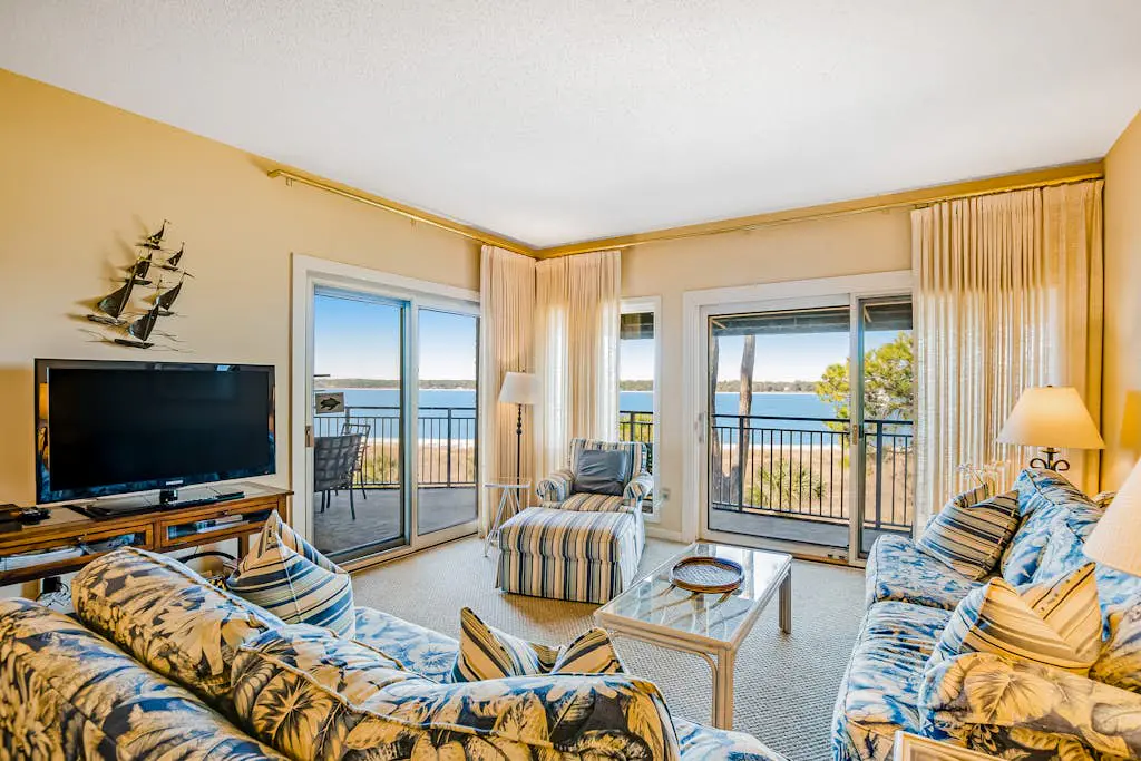 Beachfront condo with large furnished balcony, pool & beautiful views