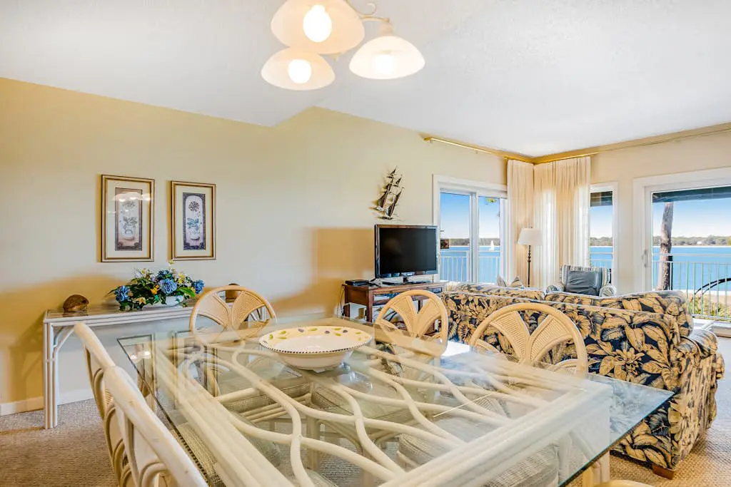 Beachfront condo with large furnished balcony, pool & beautiful views