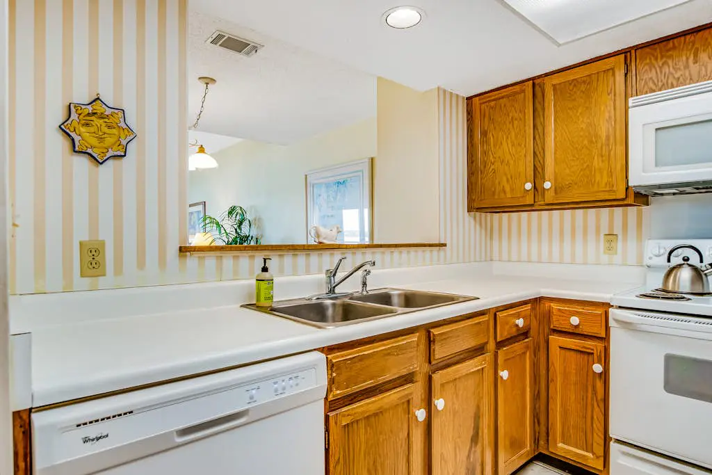 Beachfront condo with large furnished balcony, pool & beautiful views