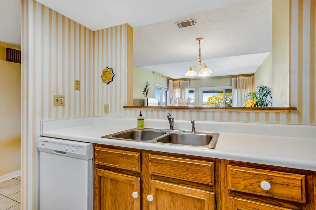 Beachfront condo with large furnished balcony, pool & beautiful views