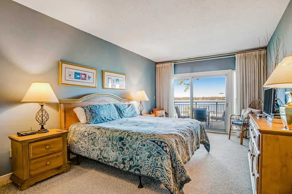 Beachfront condo with large furnished balcony, pool & beautiful views