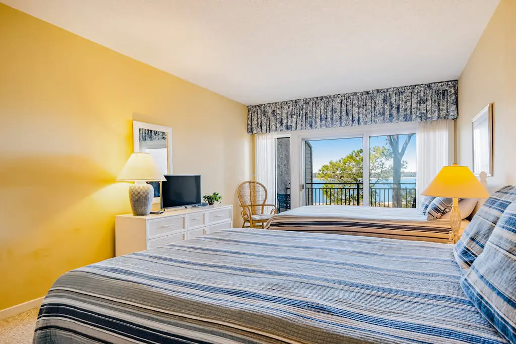 Beachfront condo with large furnished balcony, pool & beautiful views