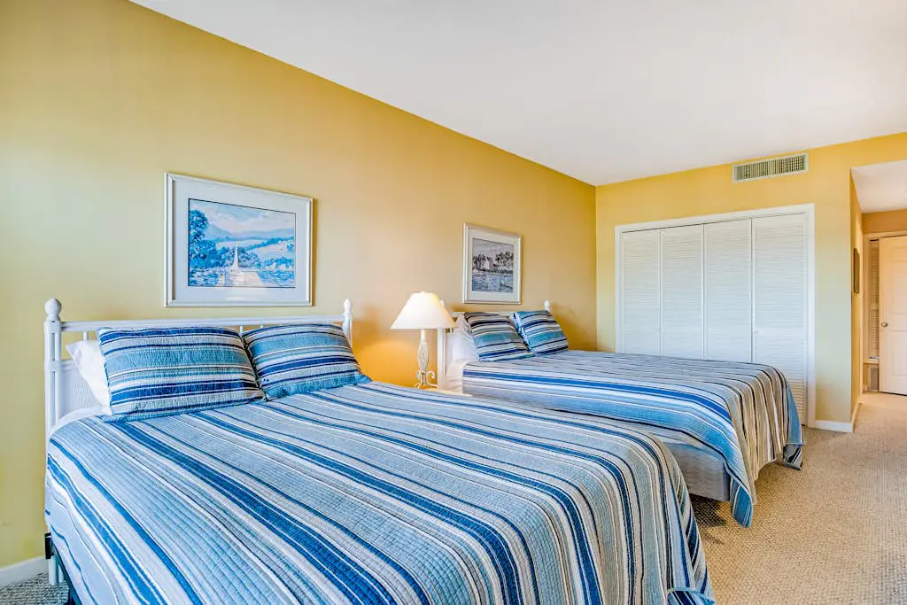 Beachfront condo with large furnished balcony, pool & beautiful views