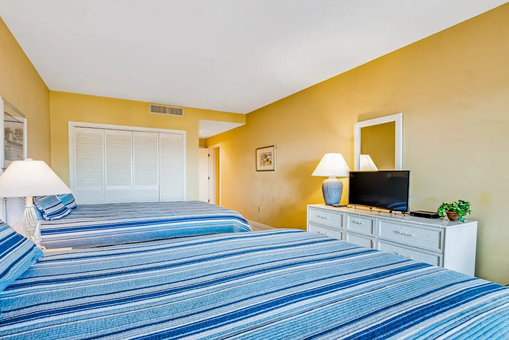 Beachfront condo with large furnished balcony, pool & beautiful views