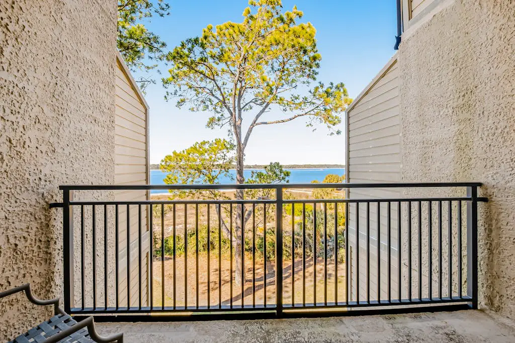 Beachfront condo with large furnished balcony, pool & beautiful views