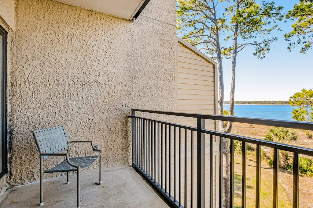 Beachfront condo with large furnished balcony, pool & beautiful views