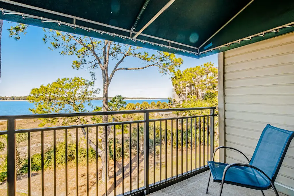 Beachfront condo with large furnished balcony, pool & beautiful views