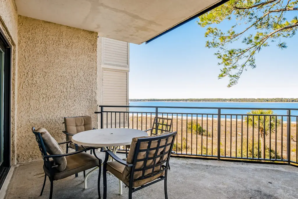 Beachfront condo with large furnished balcony, pool & beautiful views