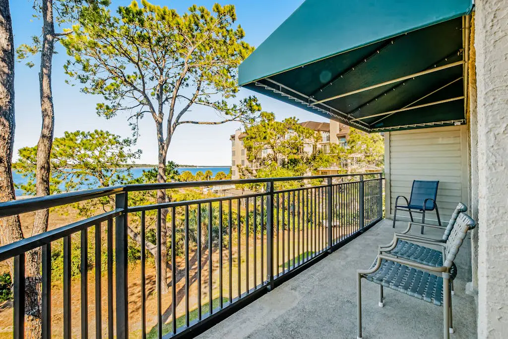 Beachfront condo with large furnished balcony, pool & beautiful views