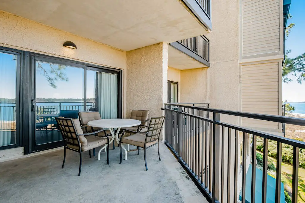 Beachfront condo with large furnished balcony, pool & beautiful views