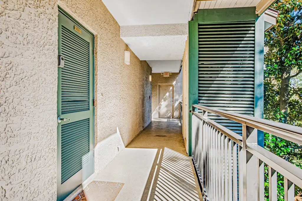 Beachfront condo with large furnished balcony, pool & beautiful views