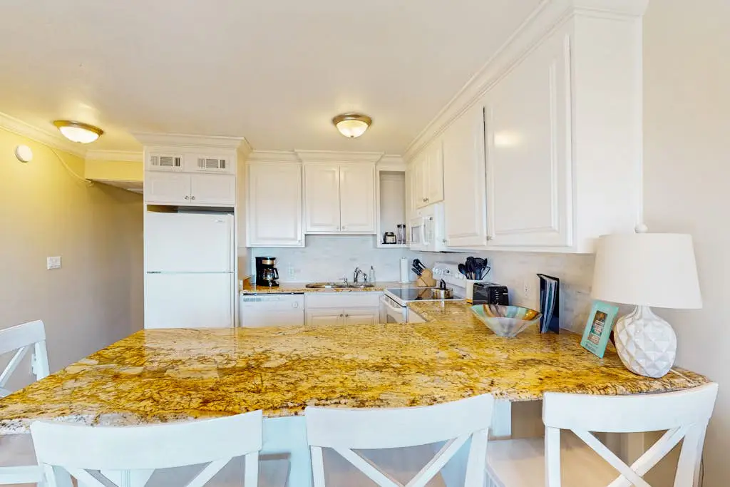 Coastal condo w/ a shared pool - steps to the beach Near shopping