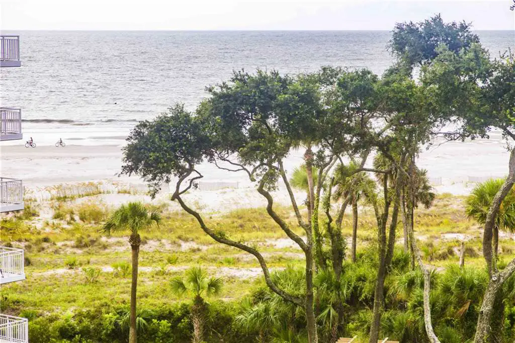 Coastal condo on the beach w/ panoramic views, beach access & a shared pool