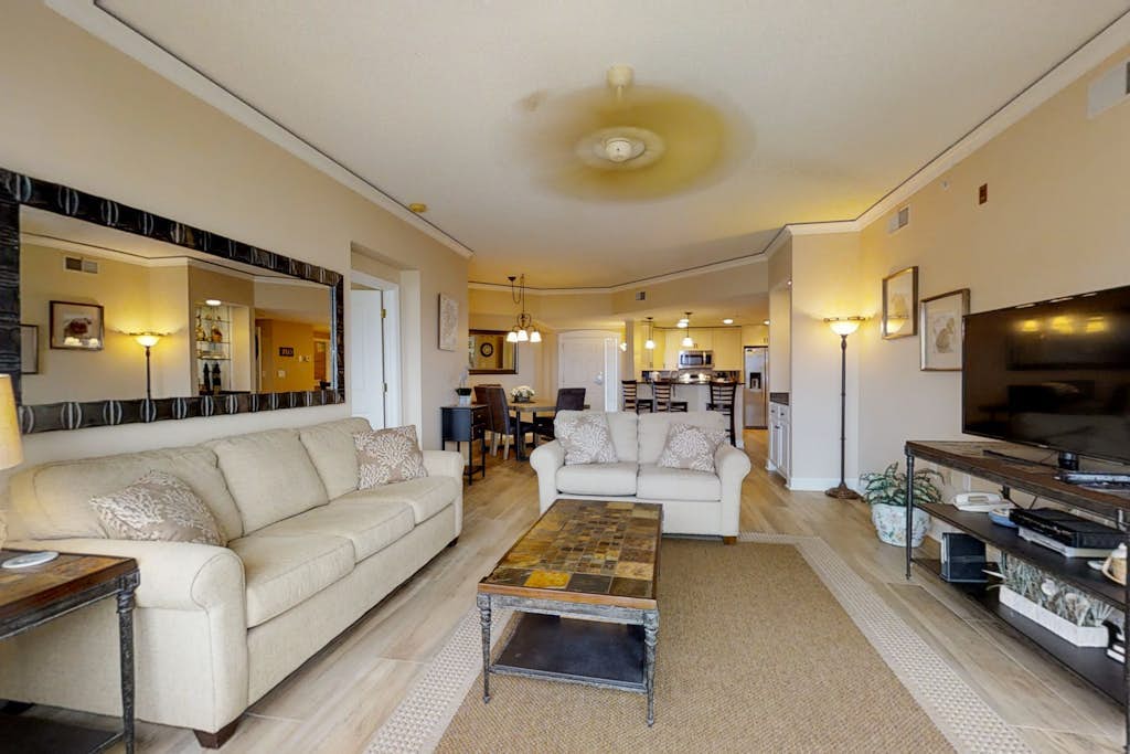 Dreamy condo on the beach with balcony view, shared pool, & charming decor