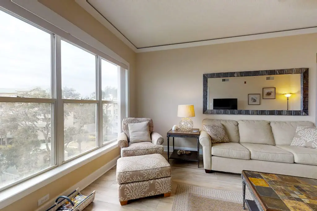 Dreamy condo on the beach w/ balcony view, shared pool, & charming decor