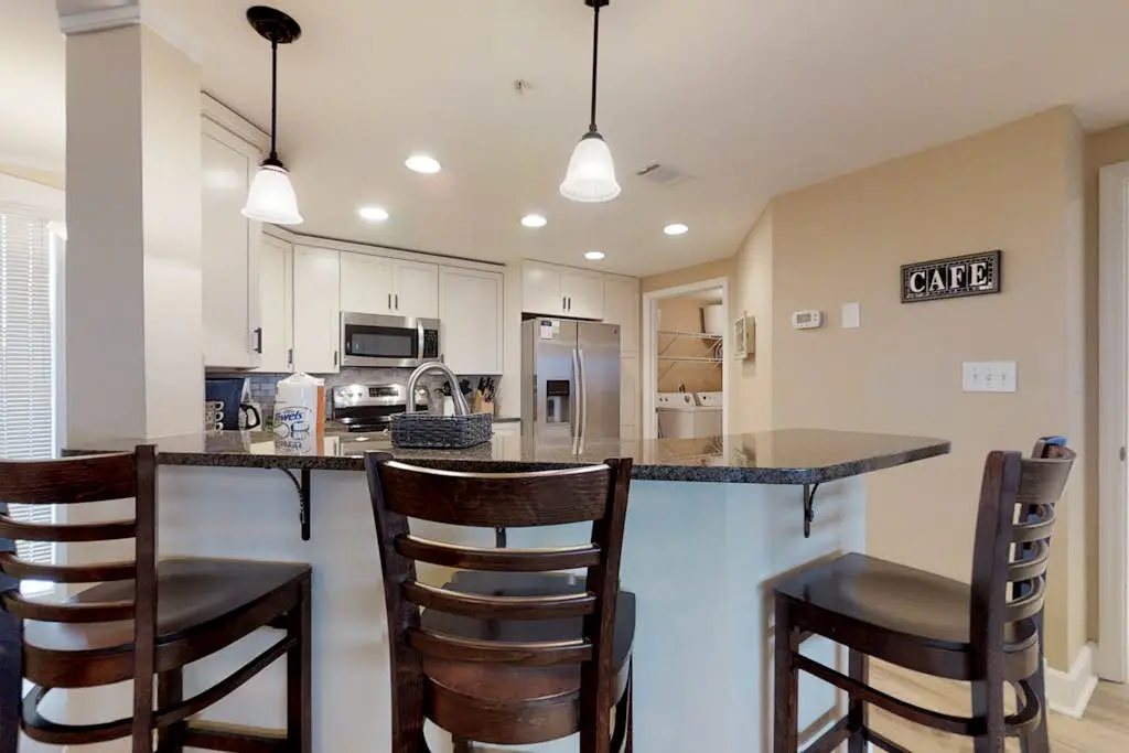 Dreamy condo on the beach w/ balcony view, shared pool, & charming decor