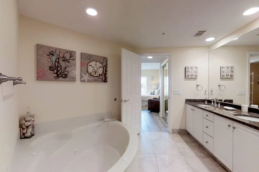 Dreamy condo on the beach w/ balcony view, shared pool, & charming decor