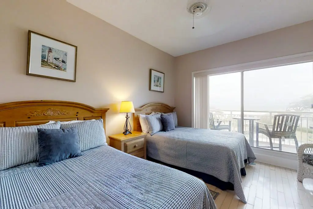 Dreamy condo on the beach w/ balcony view, shared pool, & charming decor