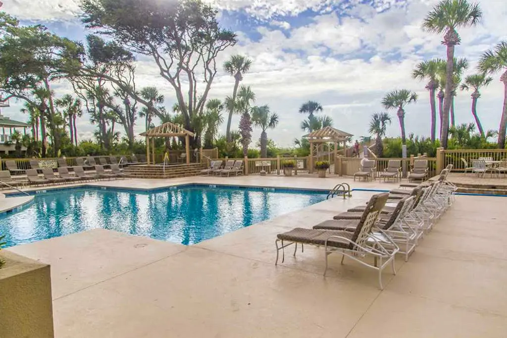 Dreamy condo on the beach w/ balcony view, shared pool, & charming decor