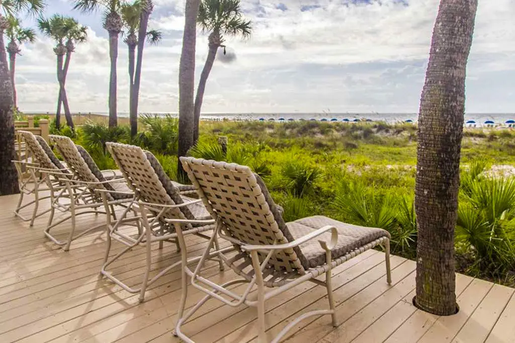 Dreamy condo on the beach w/ balcony view, shared pool, & charming decor