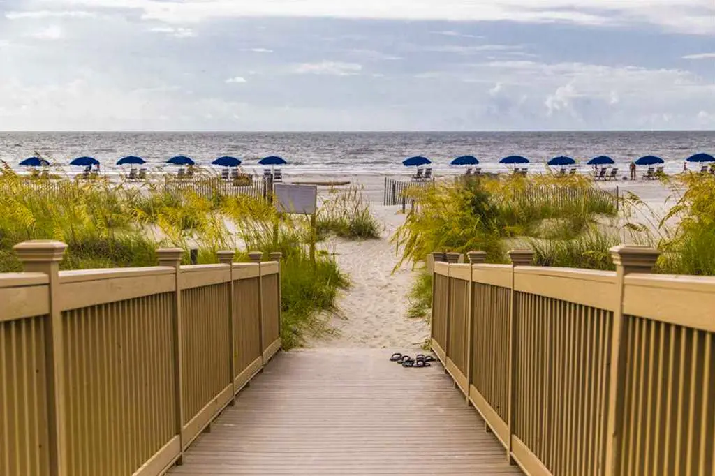 Dreamy condo on the beach w/ balcony view, shared pool, & charming decor