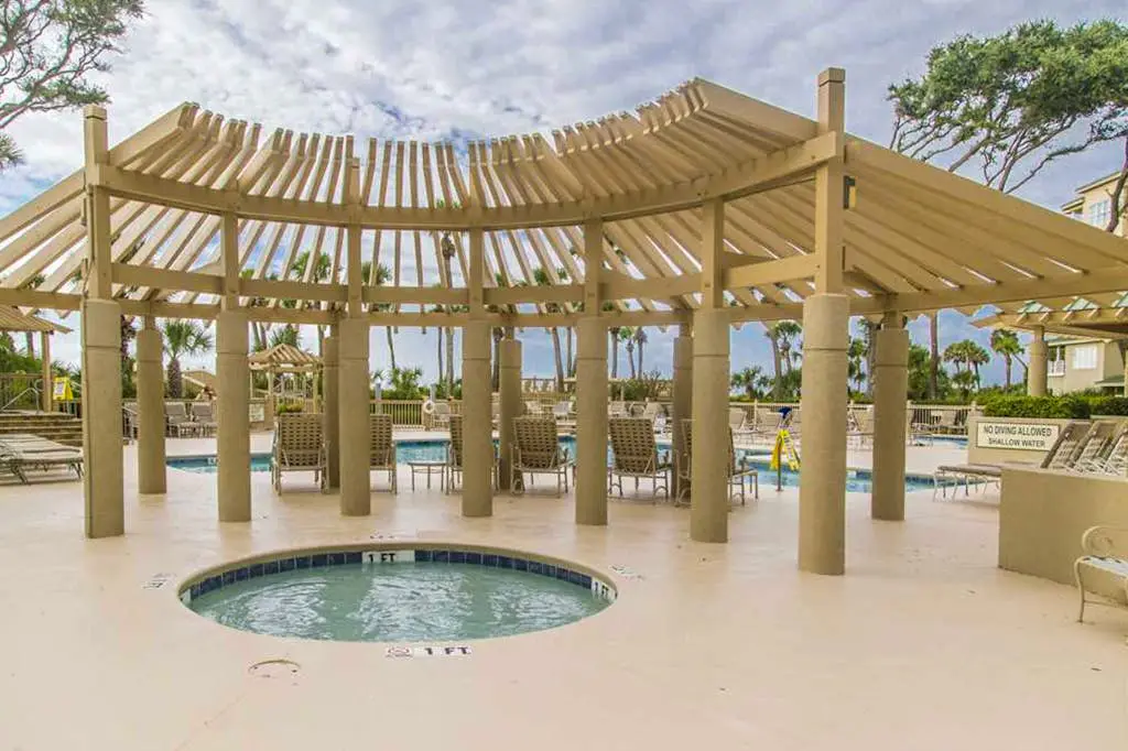 Dreamy condo on the beach w/ balcony view, shared pool, & charming decor
