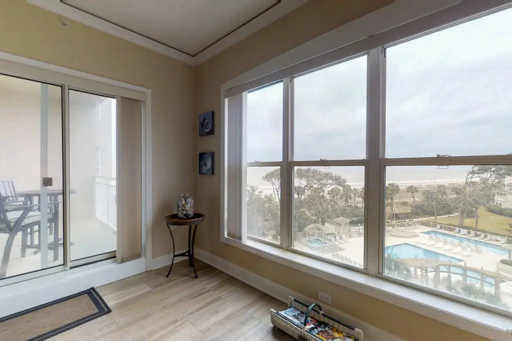 Dreamy condo on the beach w/ balcony view, shared pool, & charming decor