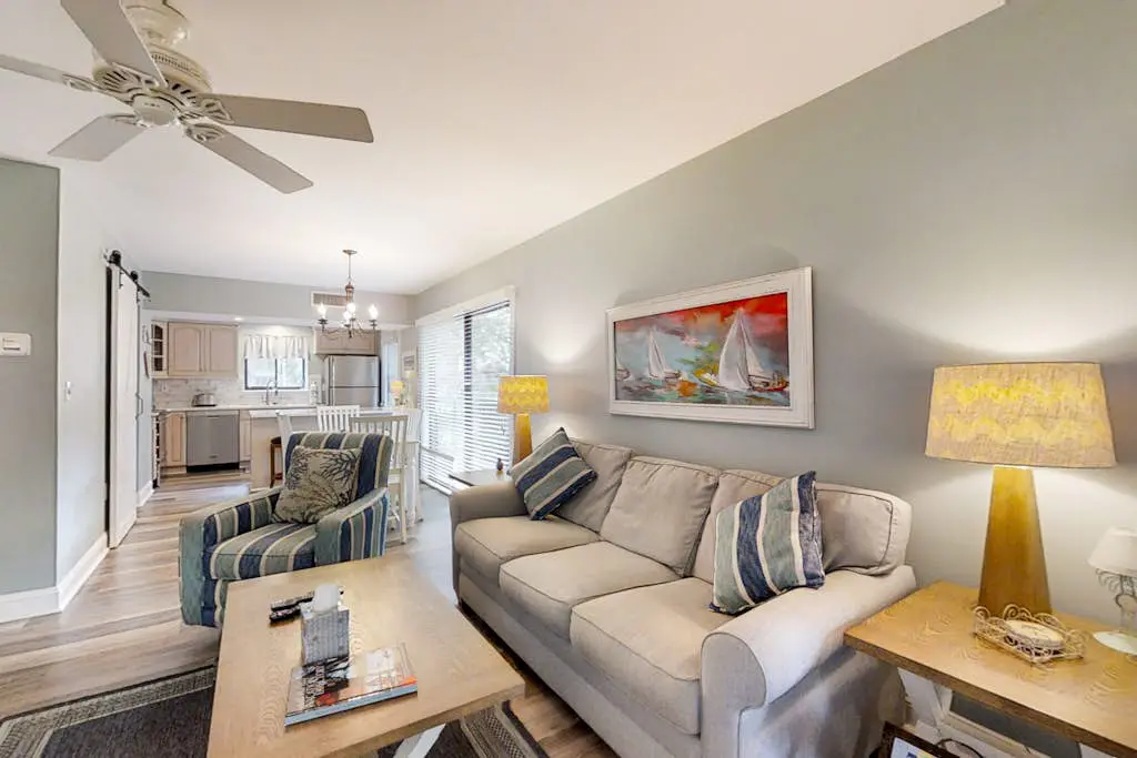 Bright, charming condo with screened porch, shared pool, and easy beach access