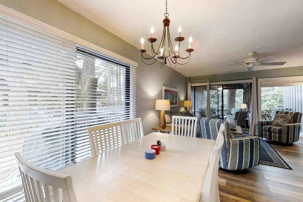 Bright, charming condo with screened porch, shared pool, and easy beach access