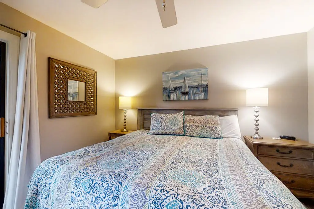 Bright, charming condo with screened porch, shared pool, and easy beach access
