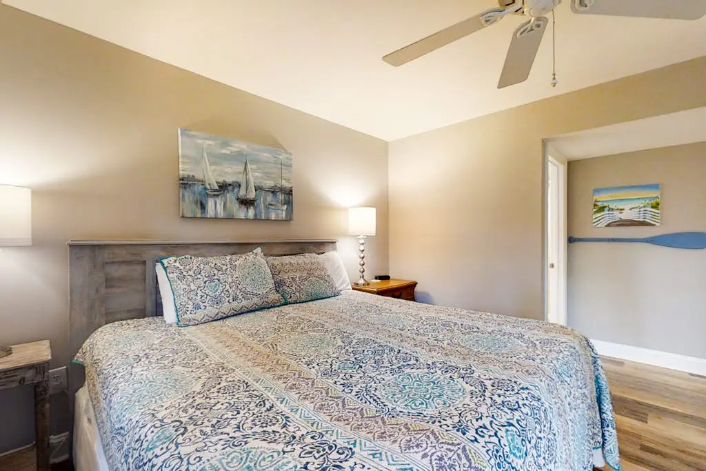 Bright, charming condo with screened porch, shared pool, and easy beach access