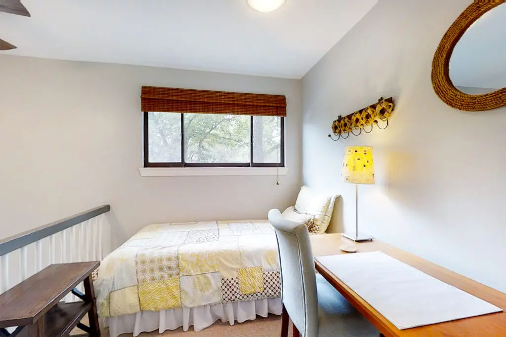 Bright, charming condo with screened porch, shared pool, and easy beach access