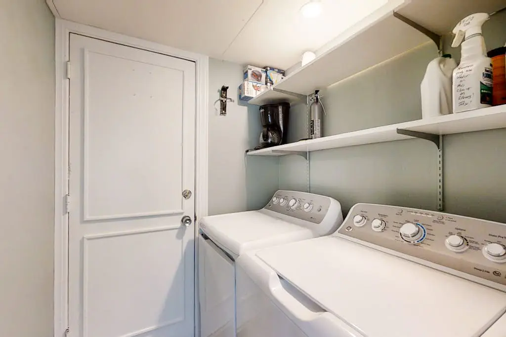 Bright, charming condo with screened porch, shared pool, and easy beach access