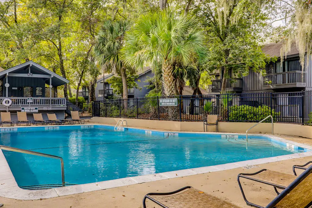 Bright, charming condo with screened porch, shared pool, and easy beach access
