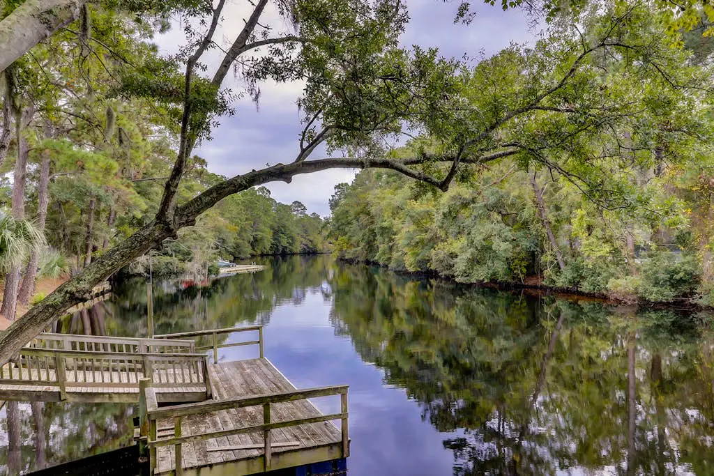 Bright, charming condo with screened porch, shared pool, and easy beach access