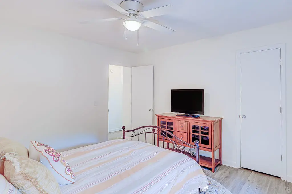 Dog friendly home with an enclosed yard, pool deck, & private pool