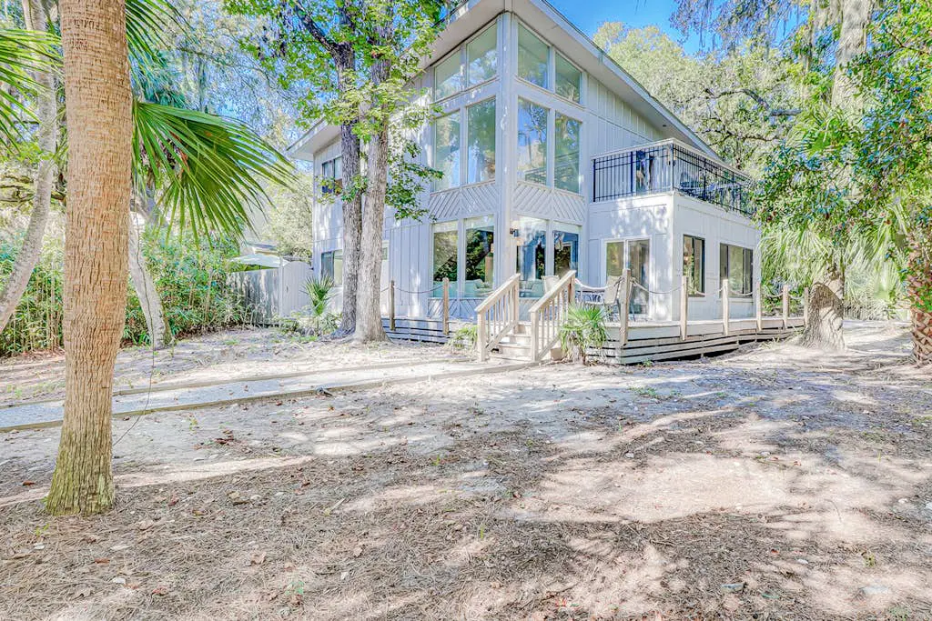Dog friendly home with an enclosed yard, pool deck, & private pool
