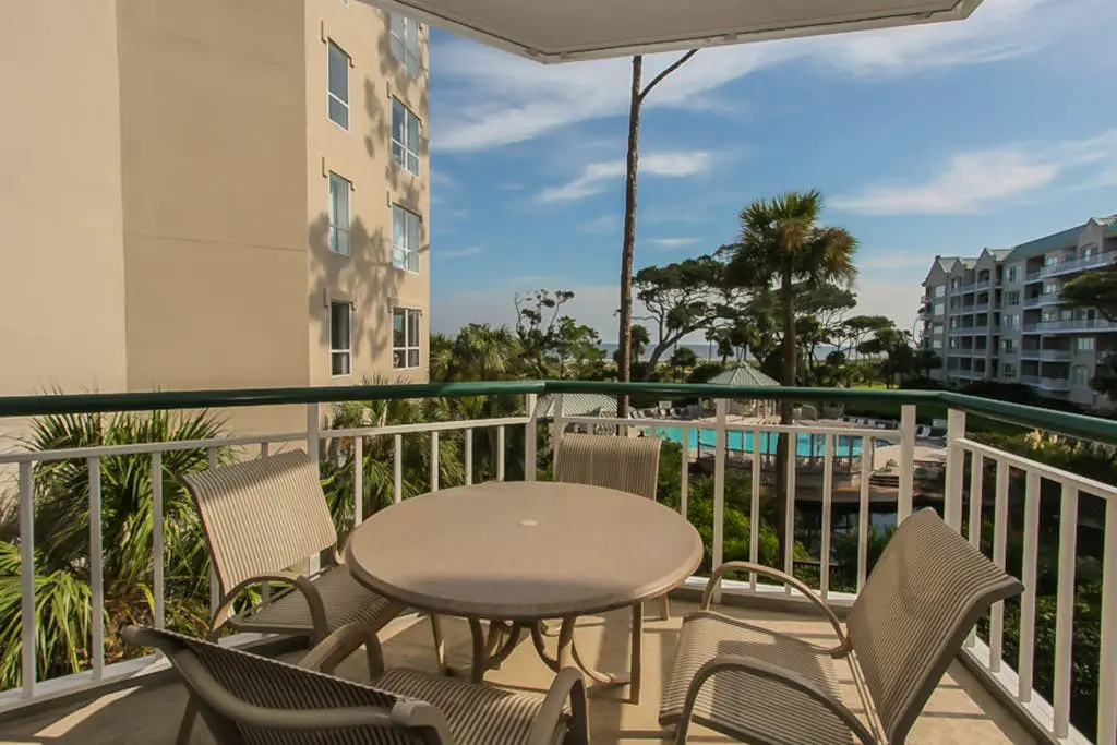Beach dream w/ balcony view & shared pool - steps from the beach