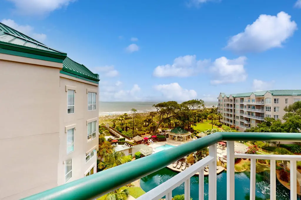 Island getaway by the ocean w/ balcony view & shared pool - beach access
