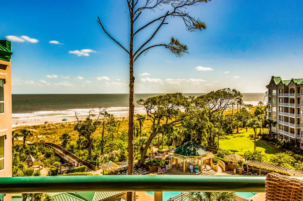Island getaway by the ocean w/ balcony view & shared pool - beach access