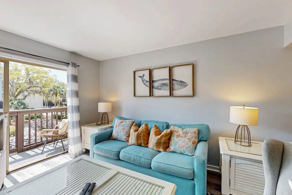 Second Floor Condo Steps to Coligny with Shared Pool, Central AC, & Beach Access